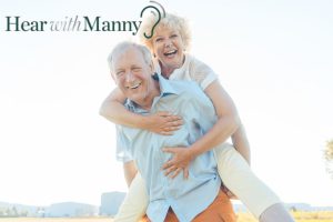 an older couple smiling and laughing together