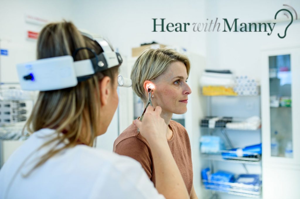 woman having her ear checked
